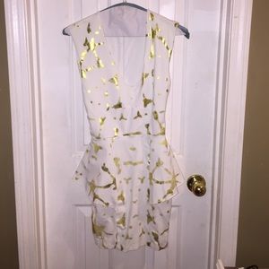 Gold and white Bebe peplum dress