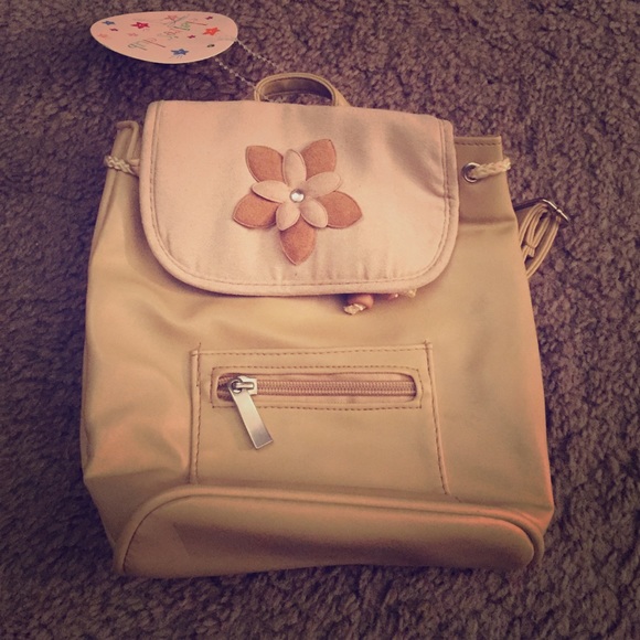 Claire's small tan backpack
