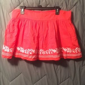 An orange-y skirt!