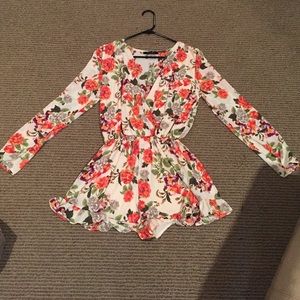 Never been worn floral long sleeve romper