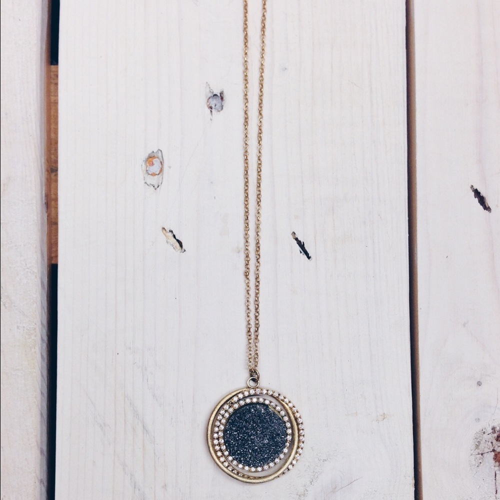 Gold necklace with diamond and glitter pendant