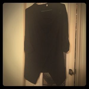 Asymmetrical poncho sweater