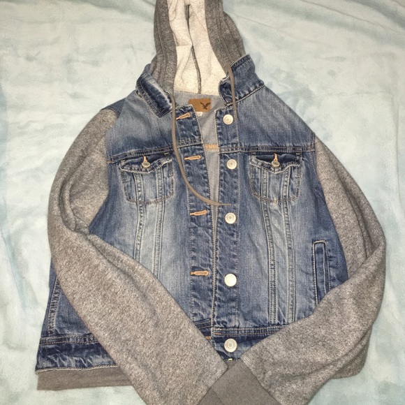 jean jacket with sweatshirt sleeves and hood.