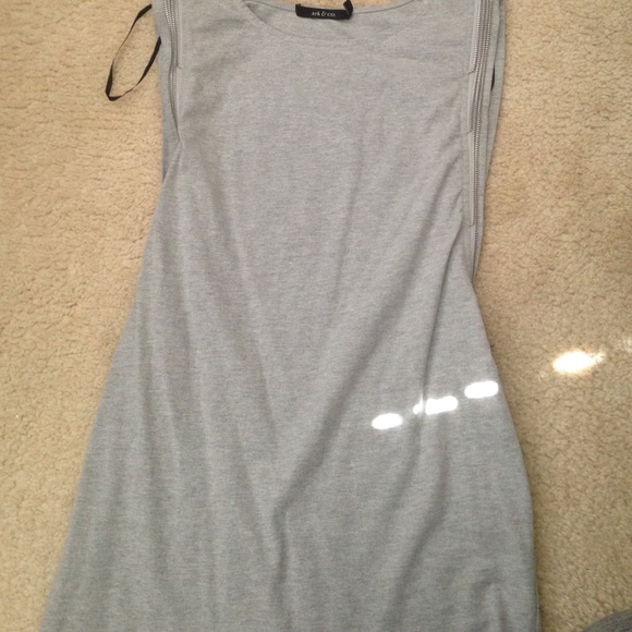 Slides zipper up and down, grey dress