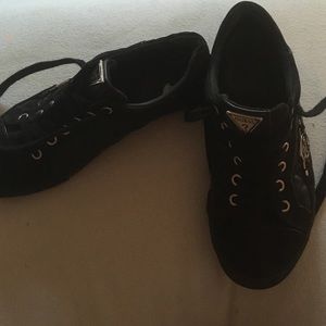 Black and gold low top shoes