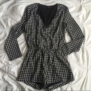 Grid print long sleeved romper plunge neck size S