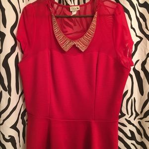 Red with gold pin on necklace