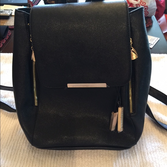 Leather tote/backpack.