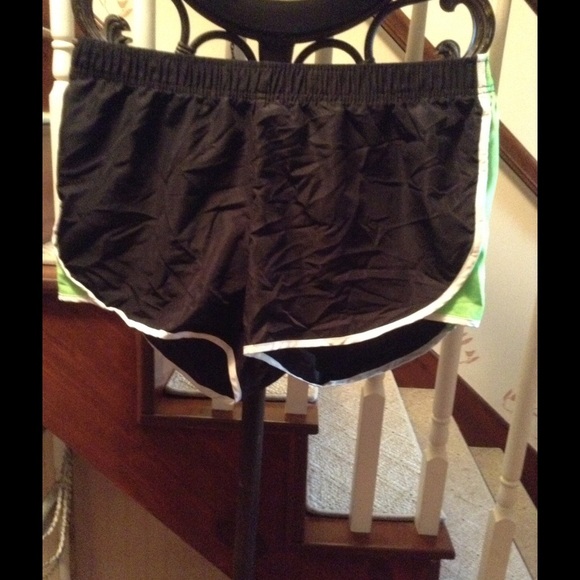 Black and green exercise shorts