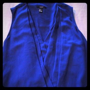 Small sleeveless blue blouse