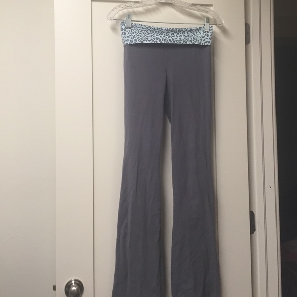 A pair of gray yoga pants with leopard print.