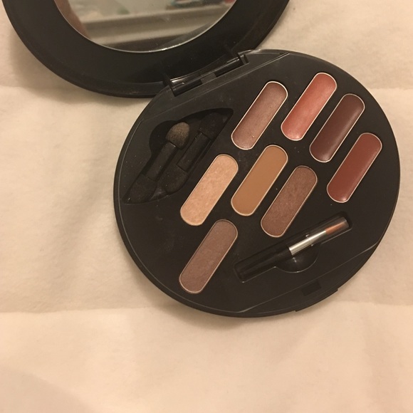 Avon eyeshadow, lip gloss, and powder