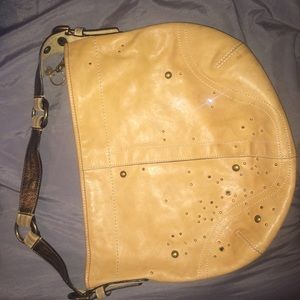 Coach tan leather purse.