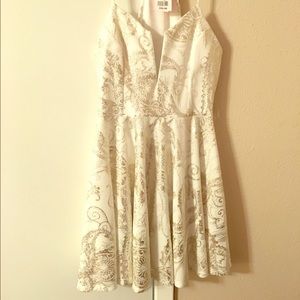 White skater dress with metallic detail