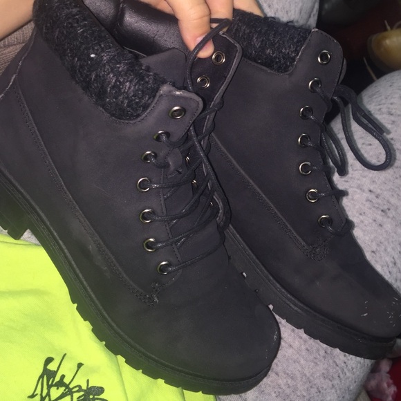 Matte black low ankle boots with knitted top.