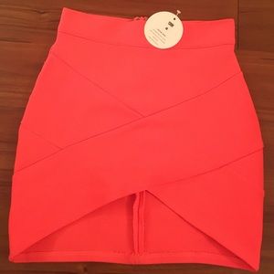 Bright coral bandage skirt.