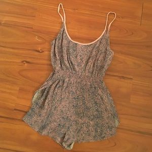 Small-patterned blue and purple flowy romper.