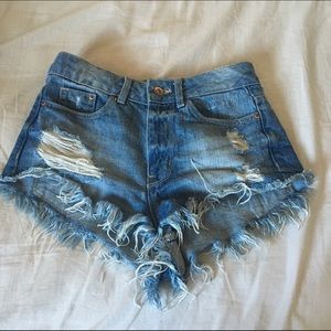 Medium washed distressed denim shorts