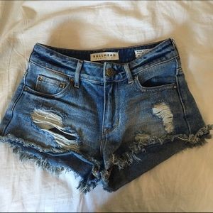 High rise distressed denim shorts