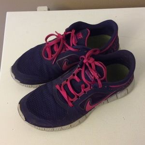 Pink and purple Nike free 5.0