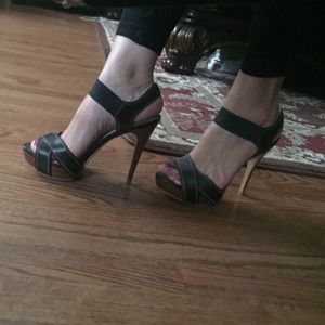 Black and brown sandals about 3 inches high