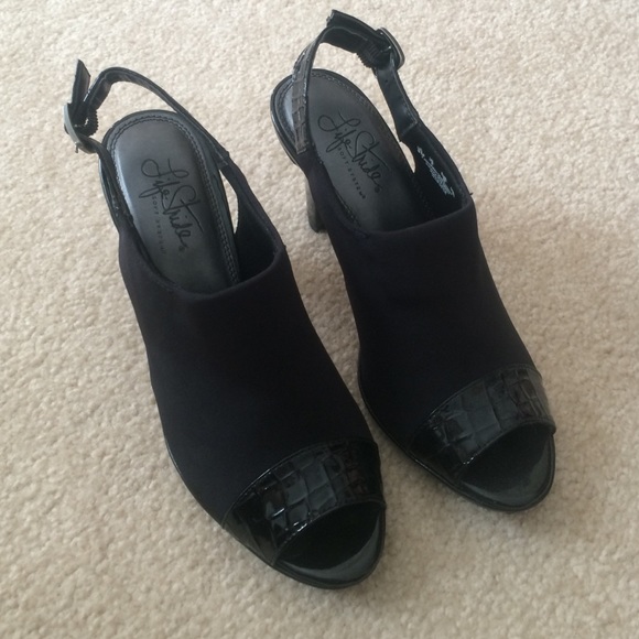 Open toe black sling back heels