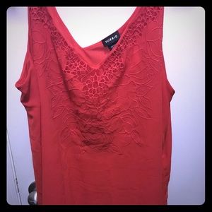 Hot red top with floral design. Plus