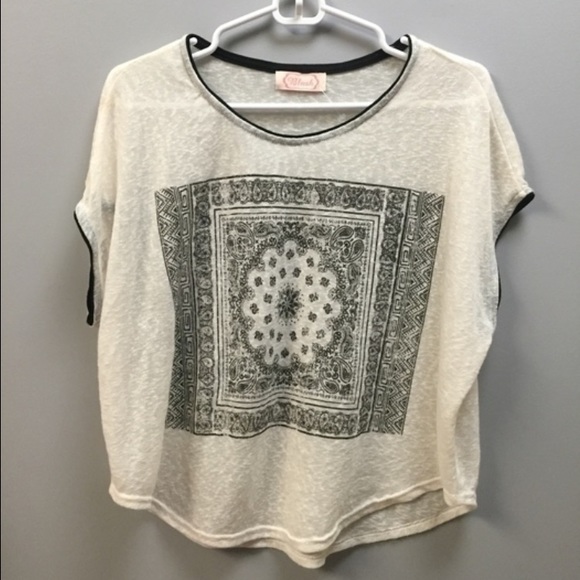 Cream top with black design