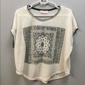 Cream top with black design