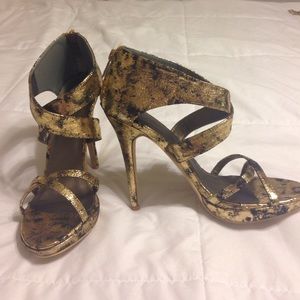 Gold and black strappy heels