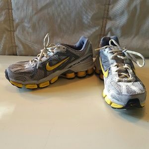 Nike Shocks in gray and yellow. Athletic shoes.