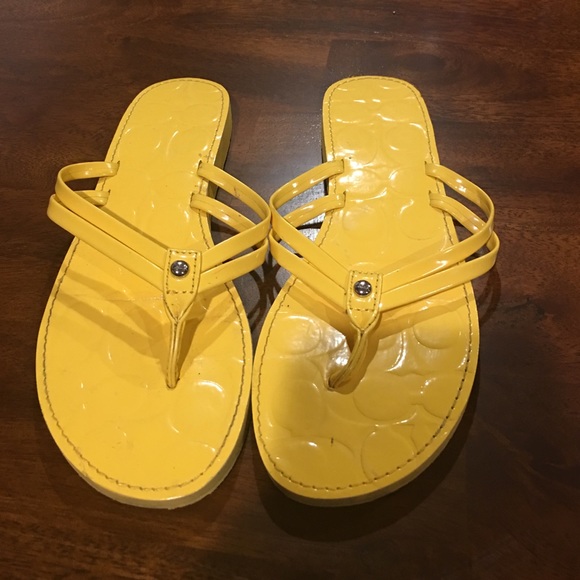 Yellow coach sandals.
