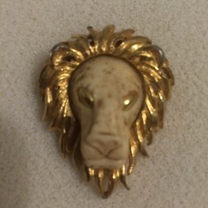 Vintage Lion Broach with faux ivory face.
