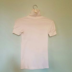 VS white turtle neck short sleeve shirt.