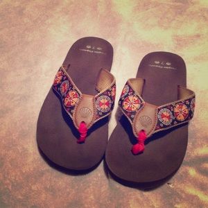 Brown sandals with pattern strap