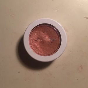 Colourpop highlighter in HIGHLY WAISTED