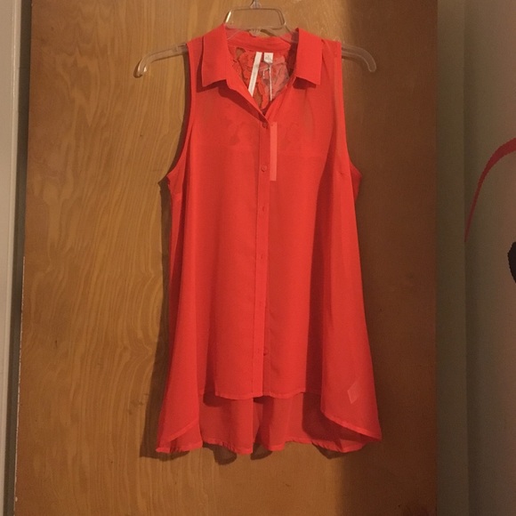 Bright orange button up chiffon blouse.