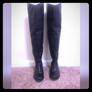 Thigh high leather boots with long gold zip