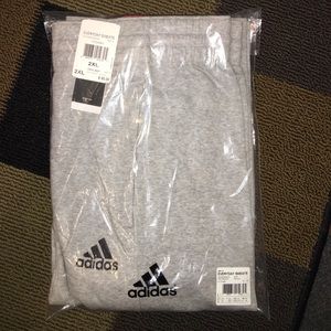 Adidas grey cotton sweatpants with front pockets.