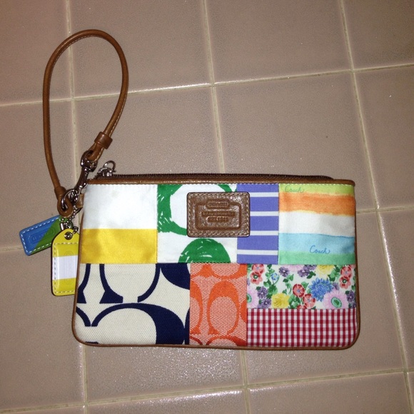 COACH leatherware clutch.