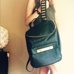 Black leather and gold backpack