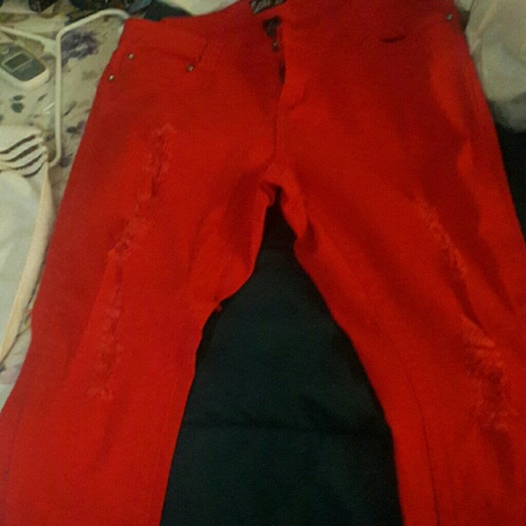 Red Jeans with rips in the legs