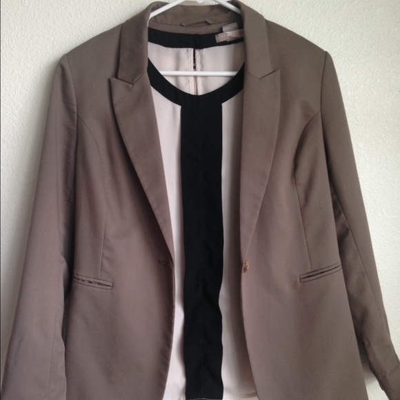 Tan blazer and cream color blouse
