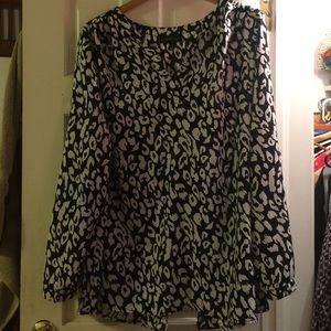 Slinky patterned blouse with surprise back.