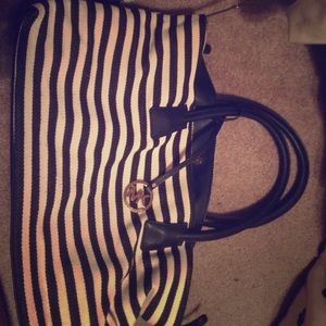 $10.00 (don't think it's a real Michael Kohrs bag)