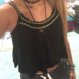 Black crop top with gold chain on top