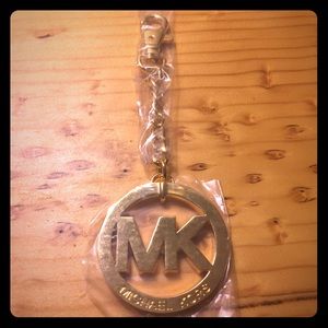 Brand new MK gold purse charm