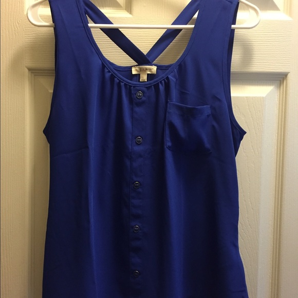 Blue sleeveless top.
