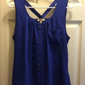 Blue sleeveless top.