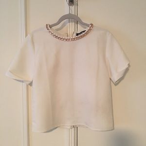 White blouse with gold detail